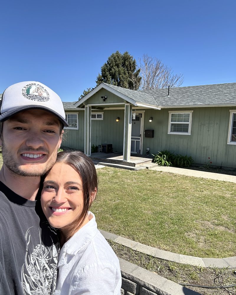 Jackson and Kaylie in front of the East Wenatchee house